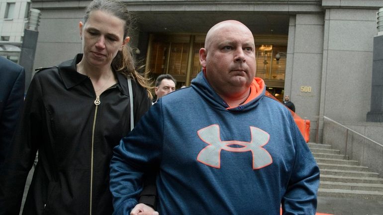 Former NYPD Officer Robert Espinel, right, exits a federal courthouse...