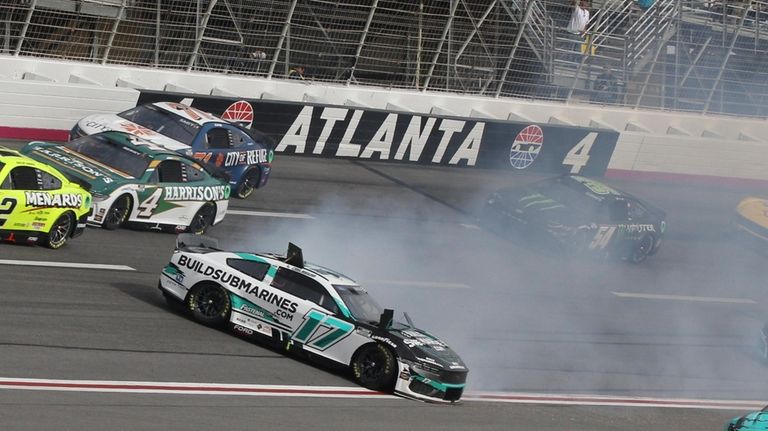 Chris Buescher (17) slides down the track during the NASCAR...