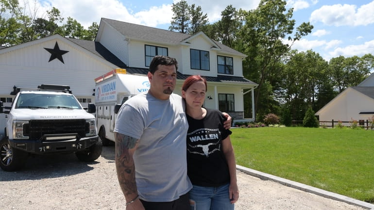 Jared and Elizabeth Zinna say the developers of their home in...