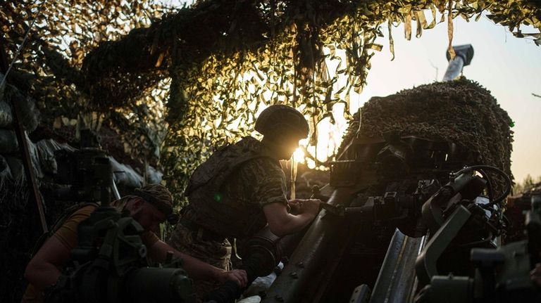 Ukrainian servicemen of 148th separate artillery brigade of the Air...