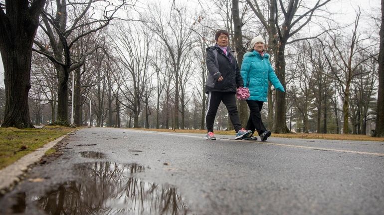 Despite wet conditions walkers still do their workout in Eisenhower...