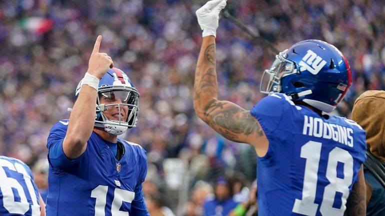 New York Giants quarterback Tommy DeVito (15) celebrates with wide...