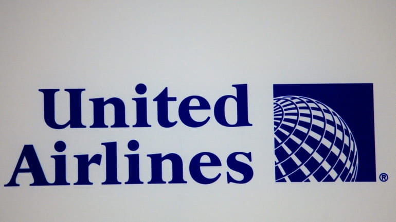 The logo for United Airlines is shown during a news...