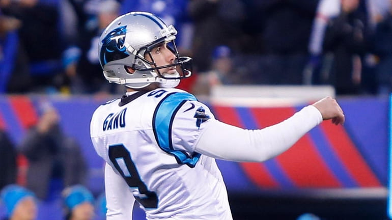 Graham Gano, then with the Panthers, follows through on his...
