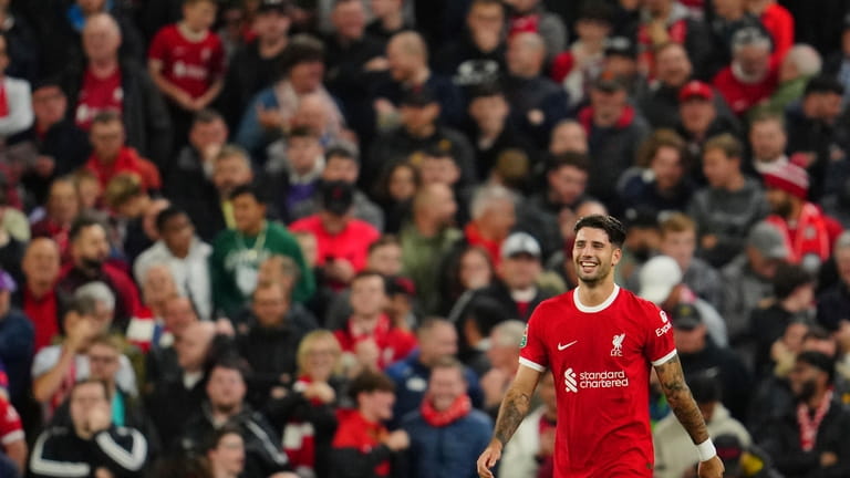Liverpool's Dominik Szoboszlai celebrates after scoring his side's second goal...
