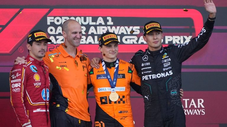 From the left, second-placed Ferrari driver Charles Leclerc of Monaco,...