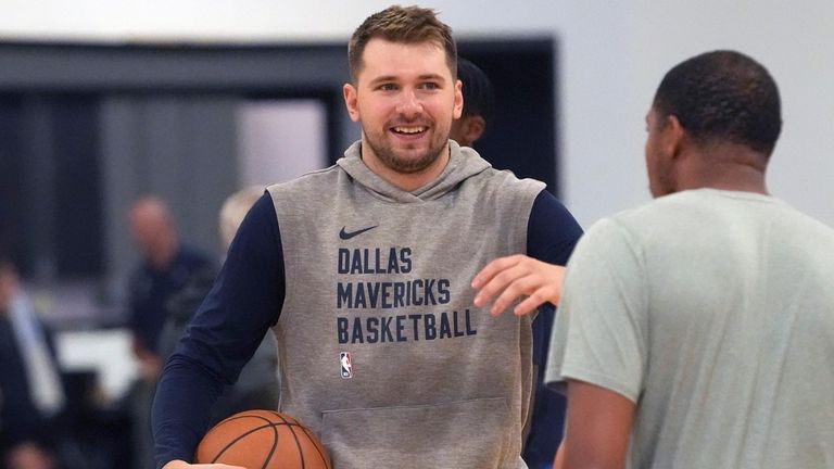 Dallas Mavericks guard Luka Doncic smiles on the court during...