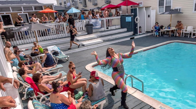 Guests enjoy a poolside drag show at the Ice Palace...