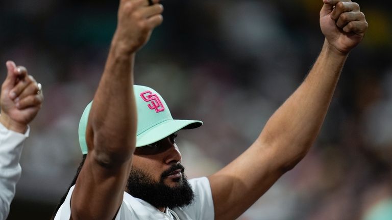 San Diego Padres's Fernando Tatis Jr. celebrates in the dugout...