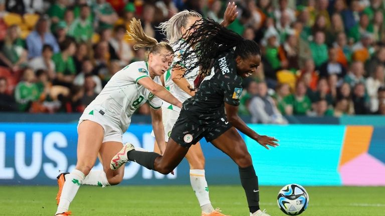 Ireland's Ruesha Littlejohn, left, battle for the ball with Nigeria's...