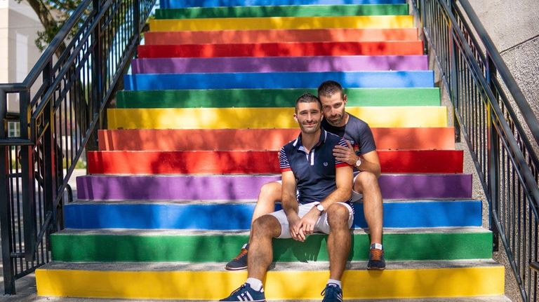 Stefan Arestis, left, with Sebastien Chaneac appear on rainbow-painted stairs...