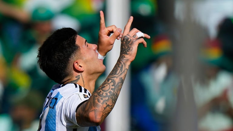 Argentina's Enzo Fernandez celebrates scoring his side first against Bolivia...