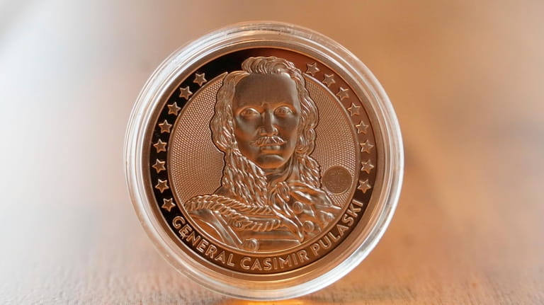An investment gold coin depicts Casimir Pulaski, a Polish hero...