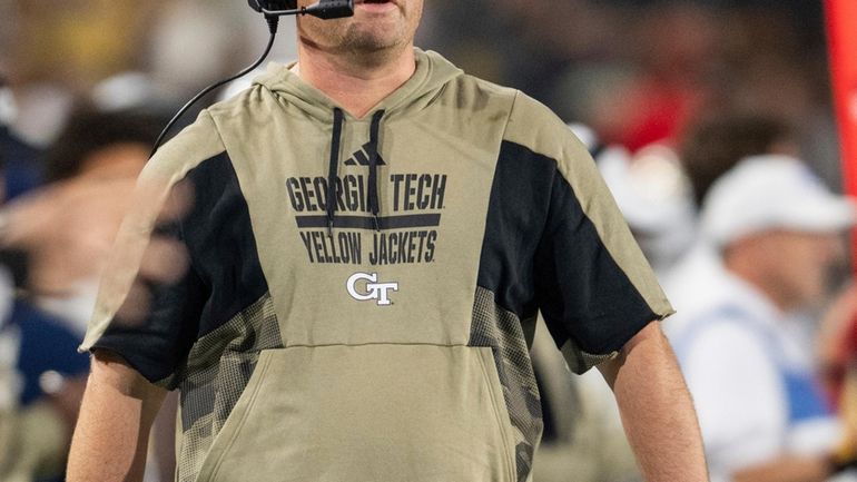 Georgia Tech coach Brent Key watches during the first half...