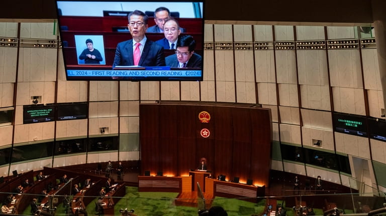 Hong Kong's Finance Secretary Paul Chan delivers the annual budget...