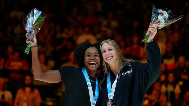 Simone Manuel and Gretchen Walsh celebrate after the Women's 50...