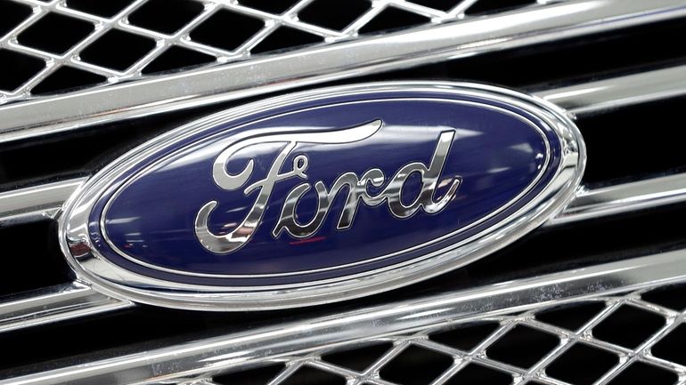 This Jan. 5, 2015, file photo shows a Ford logo...