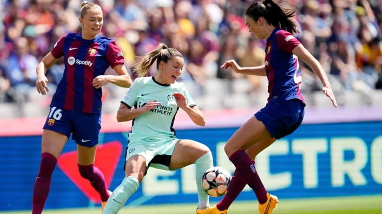 Chelsea's Johanna Rytting Kaneryd vies for the ball with Barcelona's...