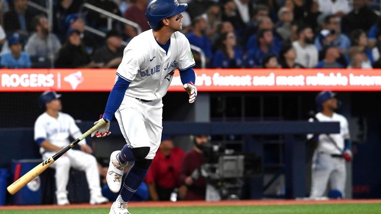 Toronto Blue Jays third baseman Ernie Clement hits a two...