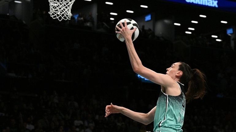 Liberty forward Breanna Stewart puts up a layup against the...