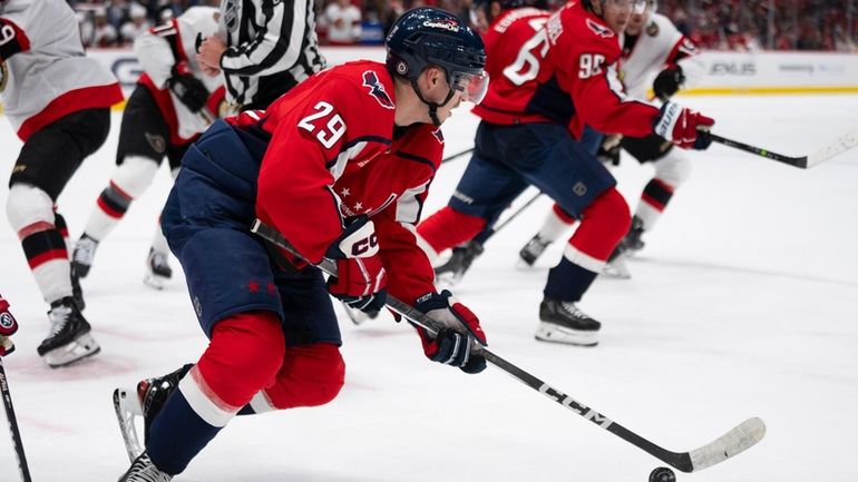 Washington Capitals center Hendrix Lapierre (29) skates with the puck...