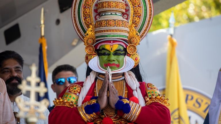 A traditional Kerala Kathakali dancer wears Pacha makeup at Onam...