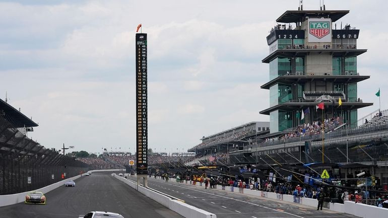 Denny Hamlin drives into a turn during a NASCAR Cup...