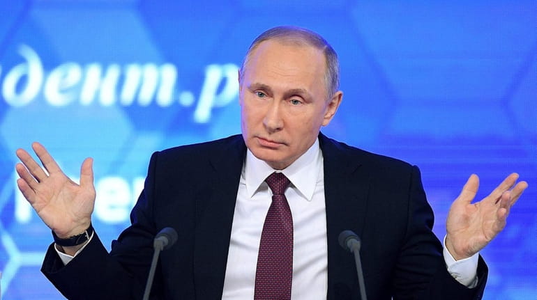 Russian President Vladimir Putin speaks during his annual press conference...