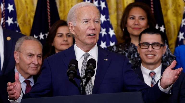 President Joe Biden speaks at an event marking the 12th...