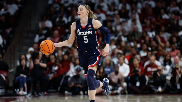 UConn guard Paige Bueckers brings the ball up court during...