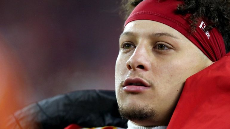 Patrick Mahomes #15 of the Kansas City Chiefs looks on...