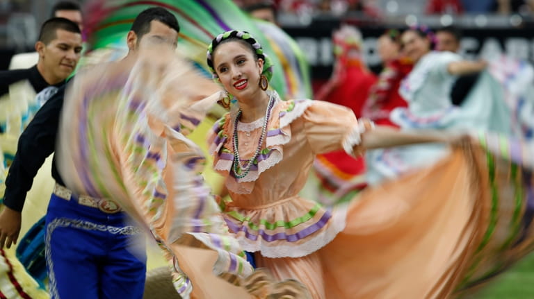 Performers participate in halftime actives in honor of Hispanic Heritage...