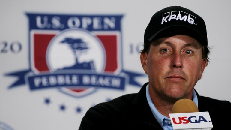 Phil Mickelson is interviewed during a press conference prior to...