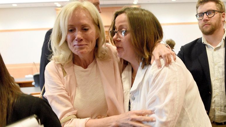 Alexandra Eckersley, right, leaves the courtroom sobbing with her mother,...