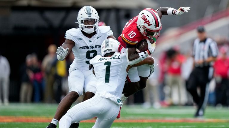 Michigan State Spartans defensive back Nikai Martinez (1) tackles Maryland...