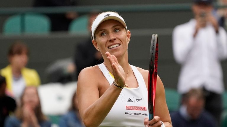 Germany's Angelique Kerber gestures, after defeating France's Kristina Mladenovic during...