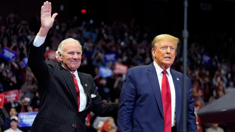 South Carolina Gov. Henry McMaster stands on stage with Republican...