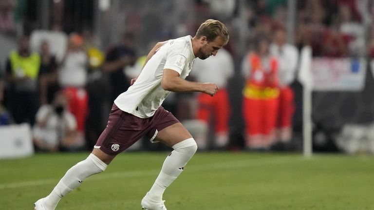 Bayern's Harry Kane enters the pitch during the German Super...