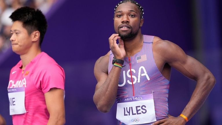 Noah Lyles, of the United States, prepares for his heat...