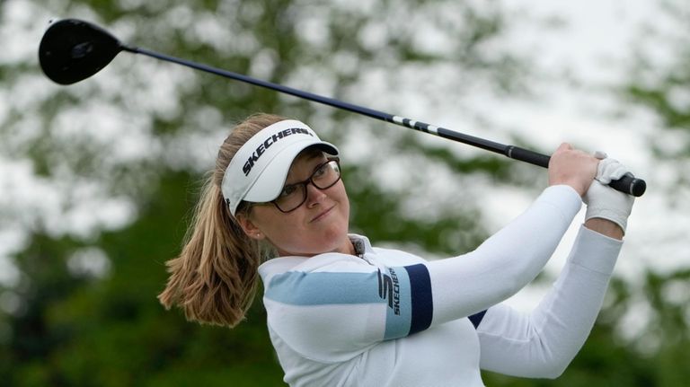 Brooke M. Henderson, of Canada, hits off the sixth tee...