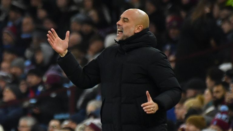 Manchester City's head coach Pep Guardiola gestures during the English...