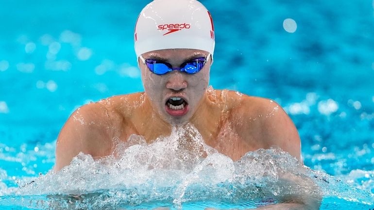 Wang Shun, of China, competes in the men's 200-meter individual...