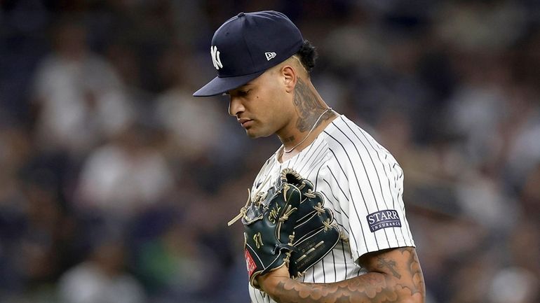 Luis Gil of the Yankees reacts during the fourth inning...