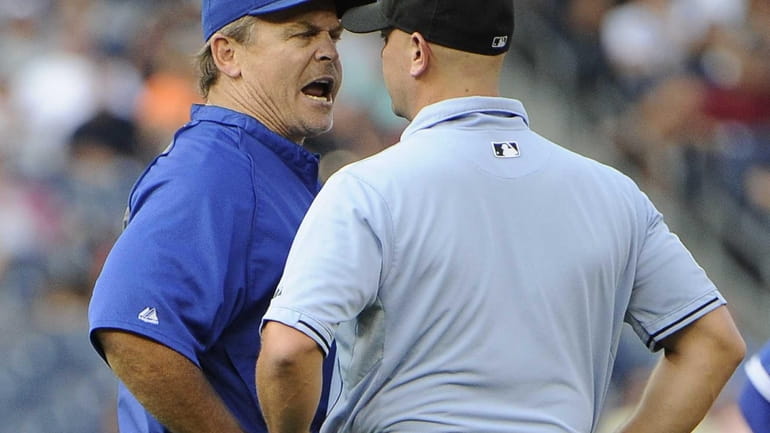 Toronto Blue Jays manager John Gibbons argues a call with...