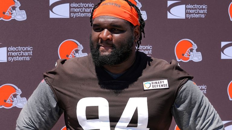 Cleveland Browns' Dalvin Tomlinson answers a question following an NFL...