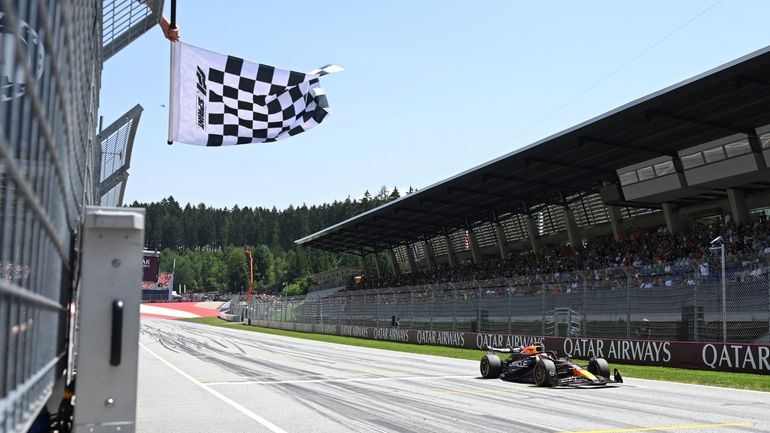 Red Bull driver Max Verstappen of the Netherlands crosses the...