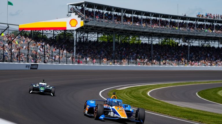 Kyle Larson drives through the first turn during the final...