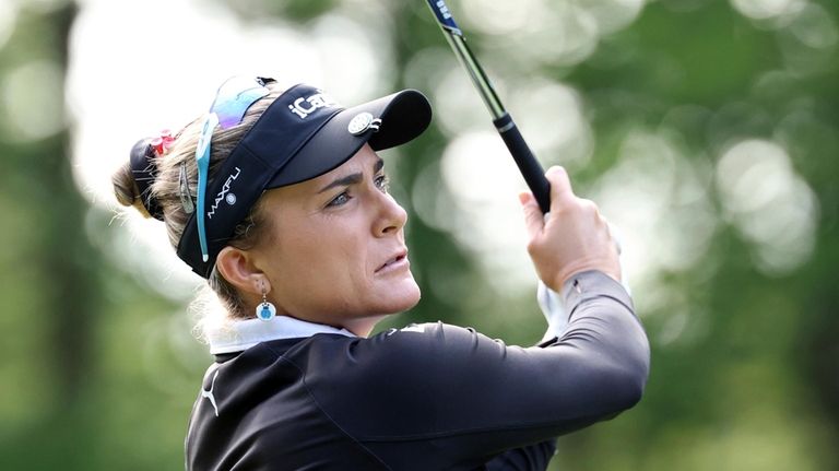 Lexi Thompson of the United States tees off on the...