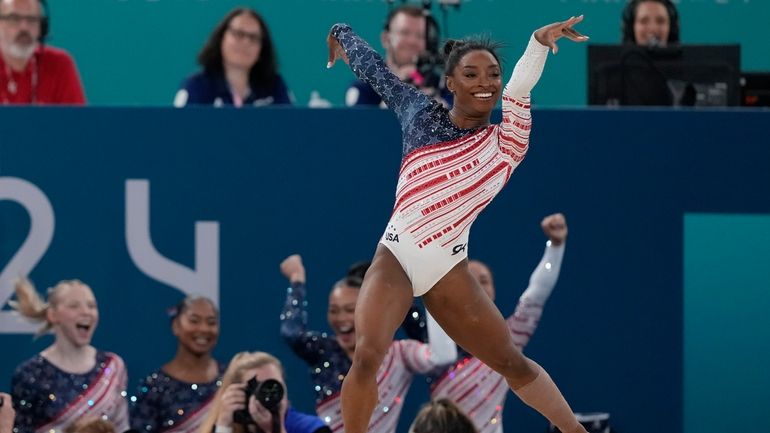 Simone Biles, of the United States, performs on the floor...