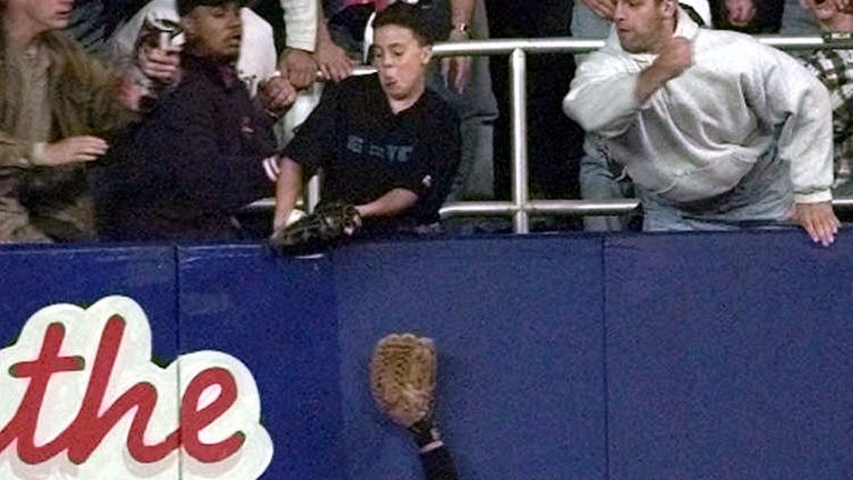 Jeffrey Maier deflects a fly ball by Derek Jeter during...